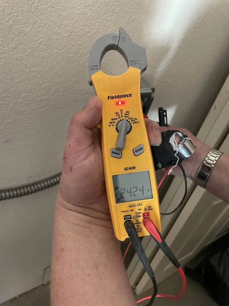 Voltage testing with clamp meter during Circuit Breaker Repair in Corry